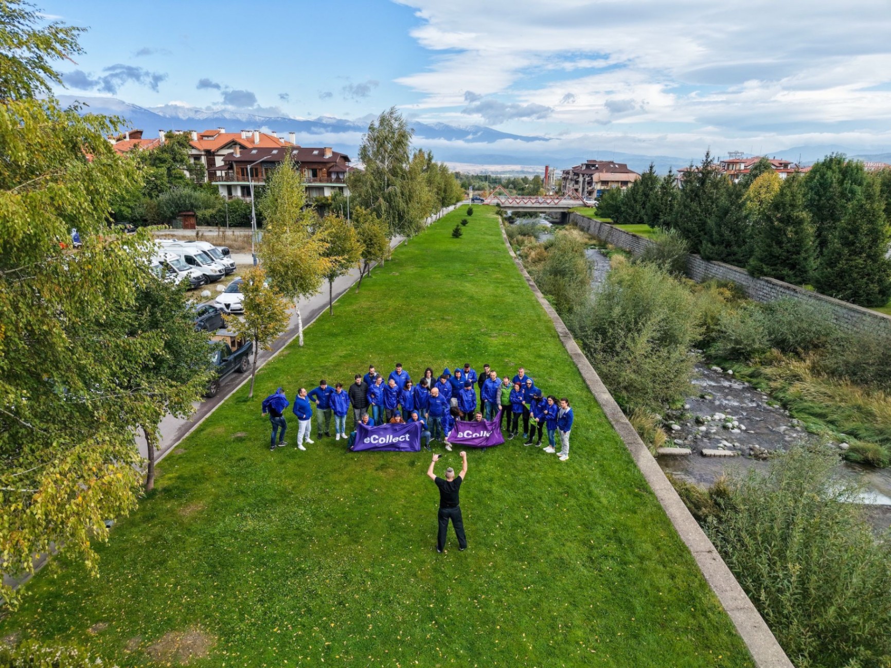 Team building retreat in Bansko — group photo by the river